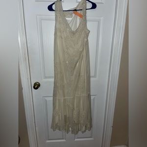 Classy delightful Simple light cream dress that was used for a wedding.